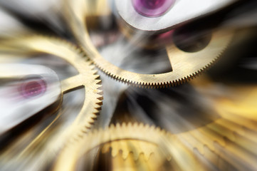 Metal Cogwheels in mechanism , abstract sun beams, Concept Movement is life, Teamwork , Idea...