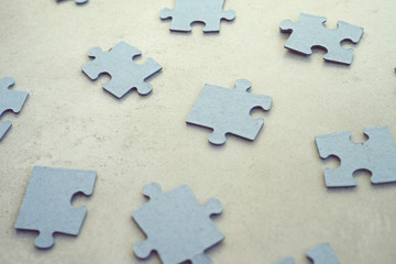 Fototapeta premium puzzle pieces on concrete dackground, selective focus