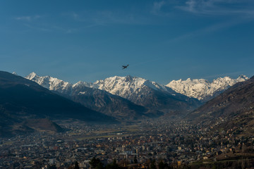 Naklejka na ściany i meble Italian Mountain with plane in flight