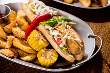 Hotdogs and French fries on a dishes. Fast food meal. Restaurant.