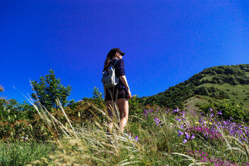Naklejka premium The girl enjoys being alone in nature. Spring Gelendzhik.