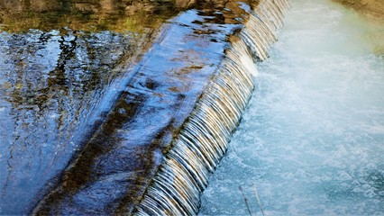 Creek and small waterfalls with reflection