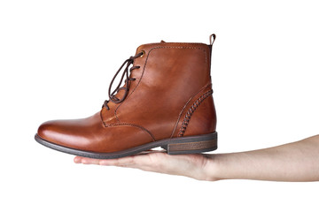 Pair of brown leather womens boots on the white background isolated