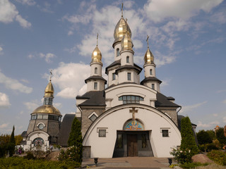 Fototapeta na wymiar Temple, Church of St. Eugene, Buki, Ukraine. Temple complex with landscape park in Buki village.