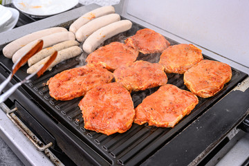 Barbecue grill bbq on coal charcoal grill with steaks bratwurst sausages and meat delicious summer meal