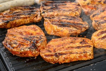 Barbecue grill bbq on coal charcoal grill with steaks bratwurst sausages and meat delicious summer meal