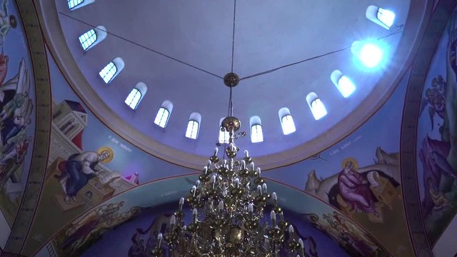 Christian temple inside with a camera in a cimbal and with tilt move from down to up and walking forward.