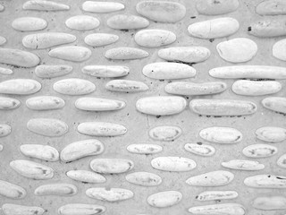 Masonry made of white pebbles. Background, texture.