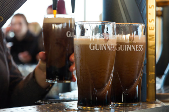 Guinness pints in a pub in Dublin Ireland on February 15, 2014.