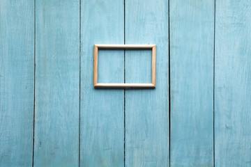 Fototapeta na wymiar wooden photo frame on wooden wall