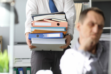 Verify completeness and correctness results work. Man carries many folders with documents for verification. Special methods and tools for quantitative analysis. Turning an idea into concrete concept.