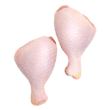 Two raw chicken legs isolated on white background. Top view.