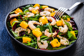 Prawn salad on black stone plate
