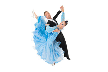 ballrom dance couple in a dance pose isolated on black background