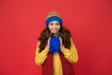 Fashion shop. Cheerful smiling child long hair in stylish outfit. Winter wardrobe. Winter fashion. Hipster fashion trend. Happy winter holidays activity. Feeling warm and happy. Comfy style