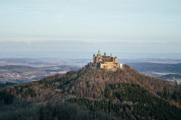 Fototapeta na wymiar Elevated view of Hohenzollern Castle at sunrise, winter landscape, Baden Wuerttemberg, Germany