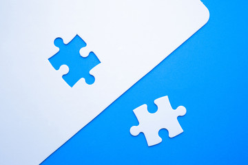 Missing jigsaw puzzle piece on blue background, business concept for completing the final puzzle...