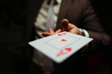 Trump in the sleeve, strategy business card game. Gambling cards, man suit throws card to floor....