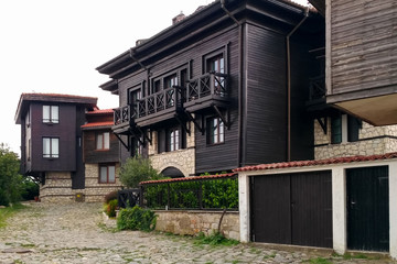 Old Town of Nesebar. Authentic wooden facade of a Bulgarian house. ground floor made of stone.