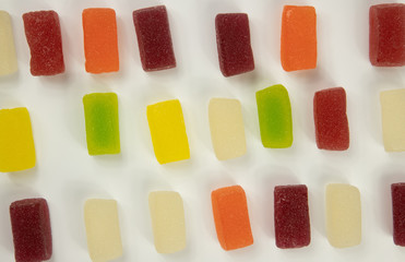 candies of colored marmalade on a white background-view from above