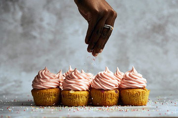 Pink confetti cupcakes with sprinkles