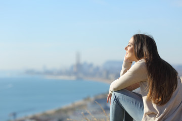 Woman meditating relaxing sitting outdoors