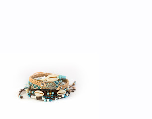women's handmade bracelets in boho style on a white background in the lower left corner space for text