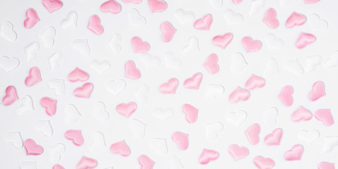 Valentine's Day background. Romantic composition with white and pink hearts on white background. Valentines Day heart. Flat lay, top view, copy space