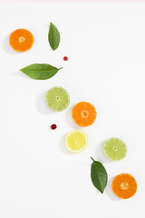 Citrus fruits pattern. Exotic fruits on white background. lemon, grapefruit, orange, lime, tangerine, fruit slices. Flat lay, top view, copy space
