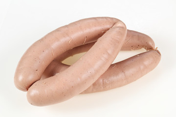 Tasty meat sausages over white background