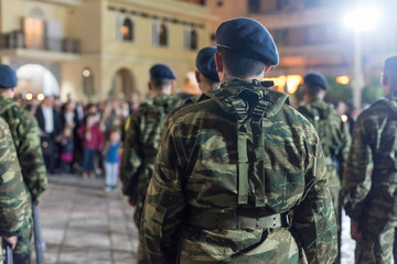 Fototapeta premium Easter celebration night outside Agios Minas Cathedral. A marching band and military parade in the old town of Heraklion.