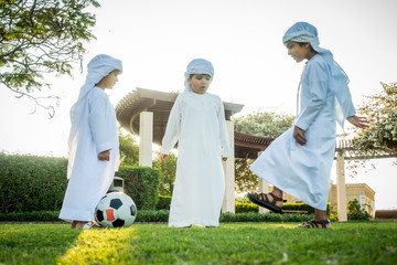 Arabic kids playing at the park in Dubai