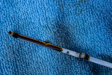Oil dipstick with blue cloth