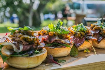 Sandwich hamburger with and mix of vegetables. Fast food. Delicious hamburger