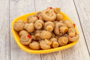 Pickled champignons in the bowl