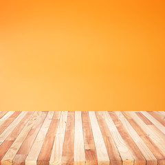 Empty of wood table top on orange pastel color background