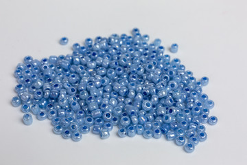 heap with tiny blue glass beads for embroidery