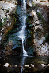Fototapeta na wymiar A tranquil waterfall in California with stepping stones