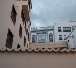 Pink wall and traditional houses at street in Santa Cruz de la Palma old city center La Palma, Canary Islands, Spain. Copy space