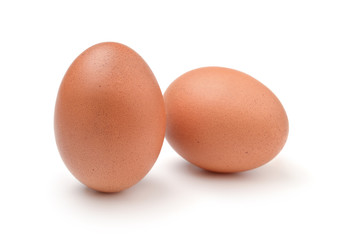 Two fresh chicken eggs isolated on white