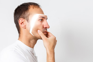 handsome man takes off his mask face