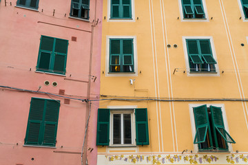 Colorful building walls and windows in Vernazza village in Cinque Terre, Italy.