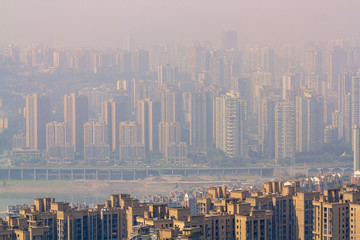 Chongqing, China - March 22, 2018: Cityscape in the morning haze. Residential neighborhoods. Motorway. Jialing River in the Chinese city of Chongqing.