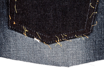 Piece of black jeans fabric with ripped of back pocket
