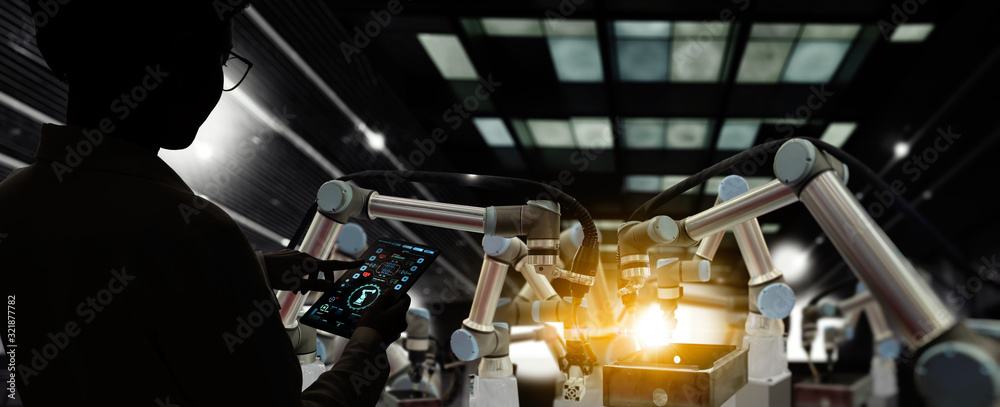 Aufkleber Factory Female Industrial Engineer working with automation robot arms machine in intelligent factory industrial on real time monitoring system software.Digital future manufacture.