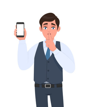 Young man in vest suit showing mobile, cell or smartphone and asking silence gesture sign with finger on lips. Keep quiet. Sh! Male character holding gadget. Modern technology in vector cartoon.