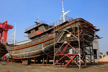 ship under construction in a shipyard
