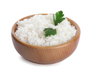 Wooden bowl with cooked rice and parsley isolated on white