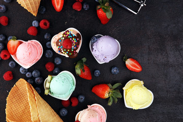 Various of ice cream flavor whit fresh blueberry, strawberry, kiwi, lemon, vanilla setup on rustic background . Summer and Sweet cold ice cream