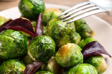 Delicious roasted Brussels sprouts with basil, closeup